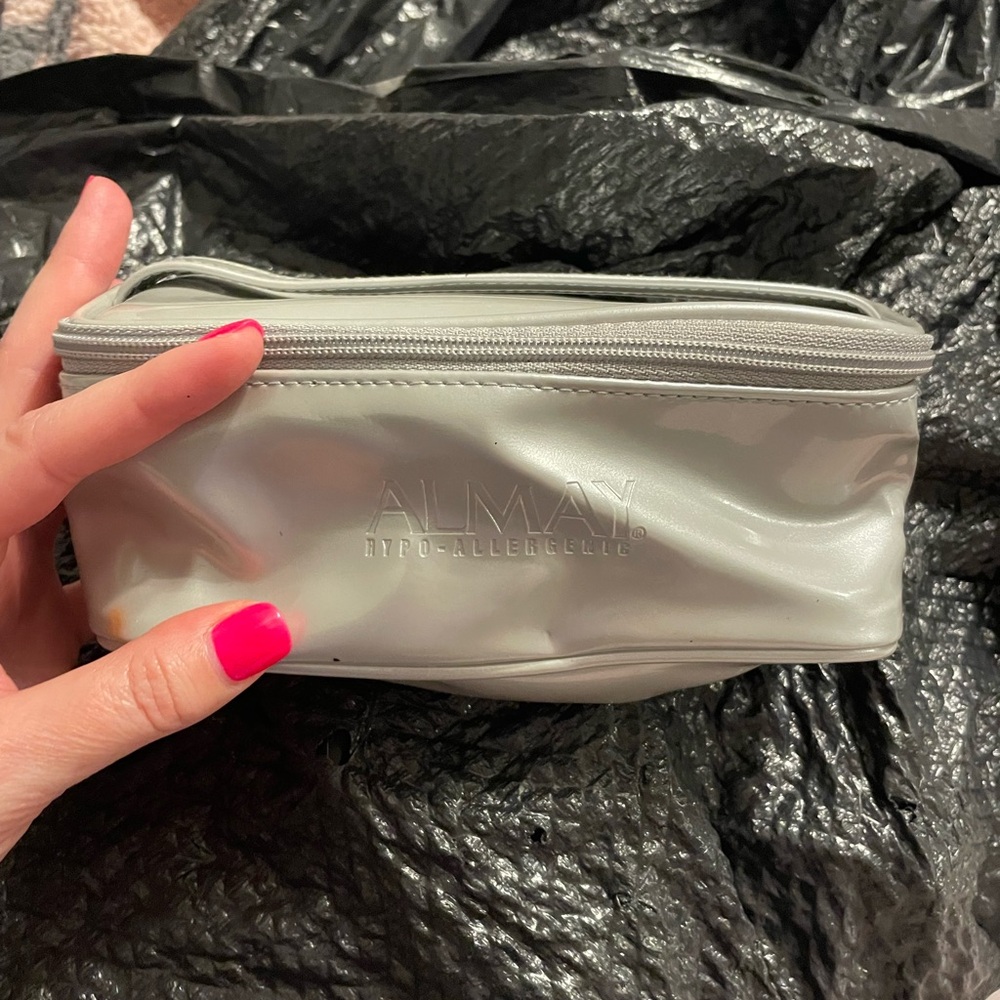 Light grey Almay zip up cosmetic pouch